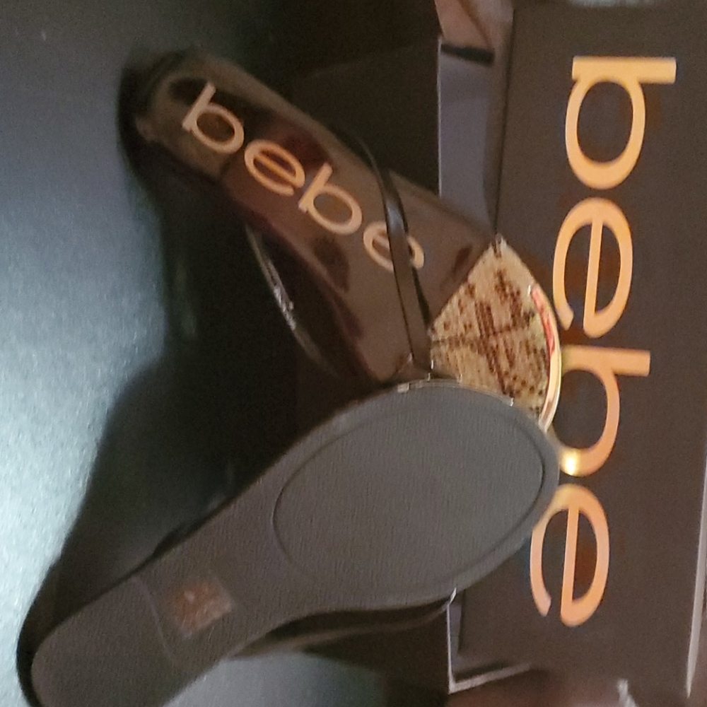 New in box. bebe black and gold flips